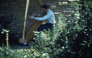 Marcel Grandjany, playing harp outdoors at Taliesin.