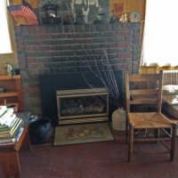 The Willey House kettle, next to the fireplace in the Burris lake cabin, in Coon Rapids, Minnesota, where it resided for decades.
