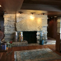 Like several examples of fireplaces in Taliesin the Pew House fireplace features an immense megalithic lintel.