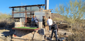 Guests taking a tour of apprentice shelters at Taliesin West