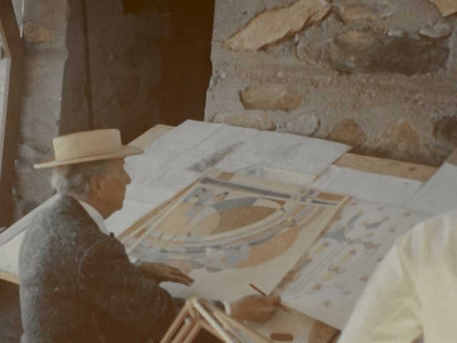 Frank Lloyd Wright at drafting table working on Liberty Magazine covers file 6007.0010