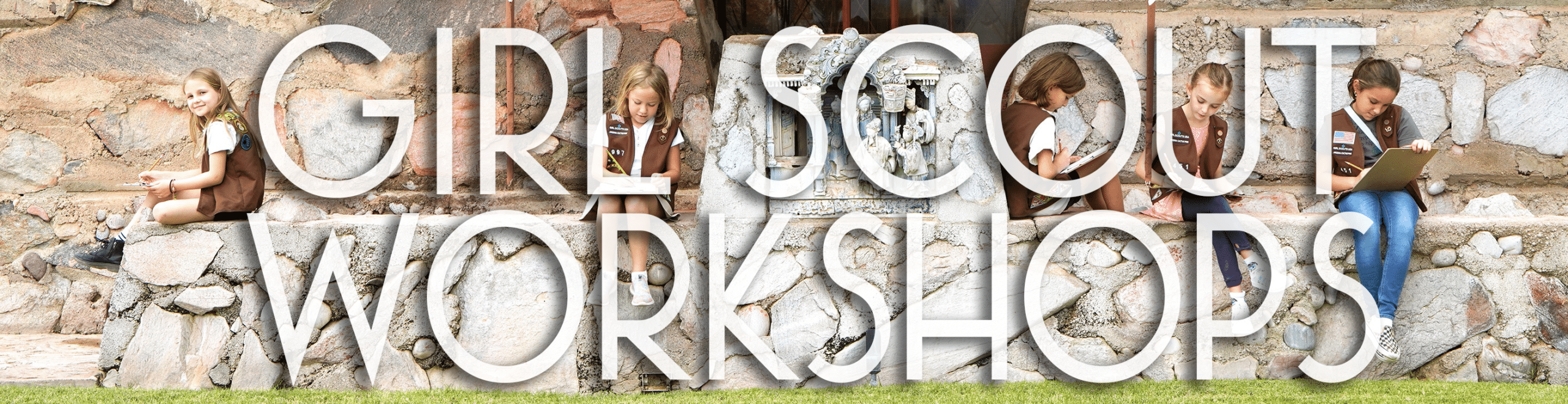 brownie scouts sitting on desert masonry walls outside of Taliesin West drawing pictures.