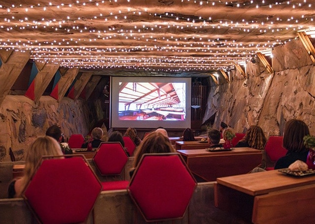 visitors enjoying a screening of a classic movie in the Cabaret Theater