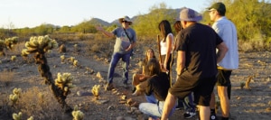Guest on a Golden Sunset Tour Hike with a tour guide exploring the Sonoran Desert near Taliesin West