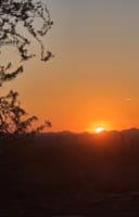 Golden Sunset Tour Hike with a view of the sun setiting in the Sonoran Desert near Taliesin West