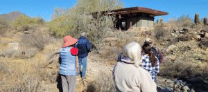 Guests on a Shelter in the Desert Hike visiting an apprentice shelter at Taliesin West