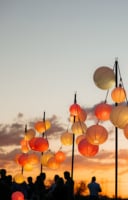 paper lanterns dancing against a sunset for a corporate event at Taliesin West